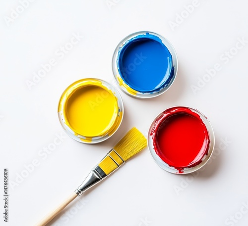 Three paint pots of primary colors