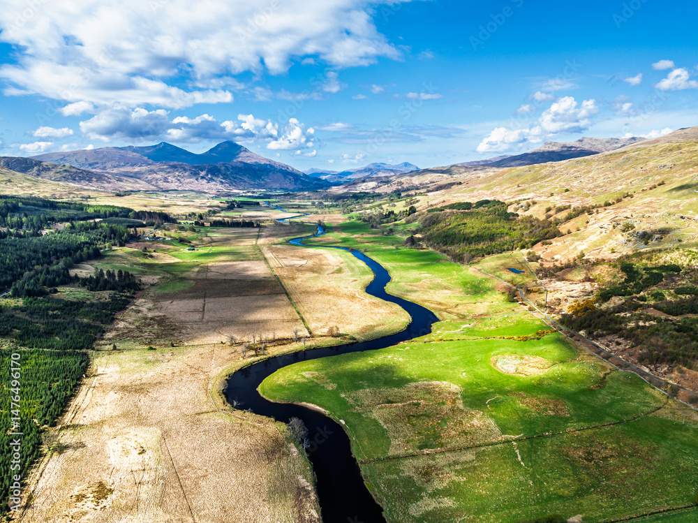 Farms and Mountains over River Dochart and Road A85 from a drone, Perthshire, Scotland, UK