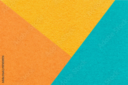 Texture craft yellow orange and blue paper background, macro. Vintage abstract cardboard