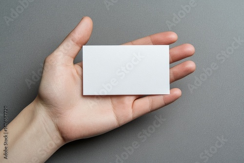 Blank business card held in hand (3)