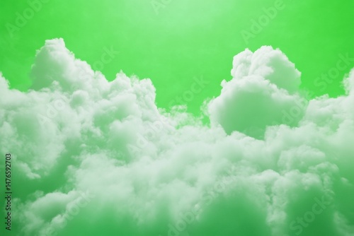 White clouds floating on a green screen background perfect for visual effects compositing. Storm cloud isolated on a green chroma key backdrop. Steam or smoke against a vibrant chromakey. Artistic sky