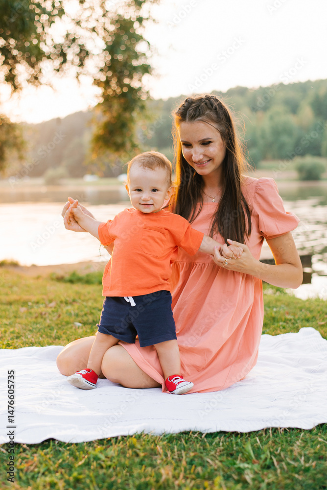 Fototapeta premium Happy Toddler Holding Mom Hands