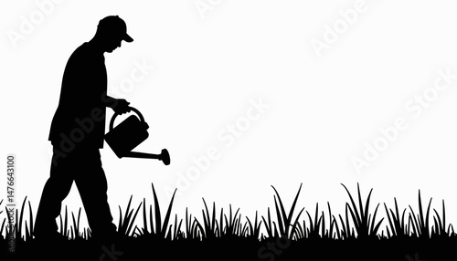 Silhouette of young man watering grass in garden, nurturing nature