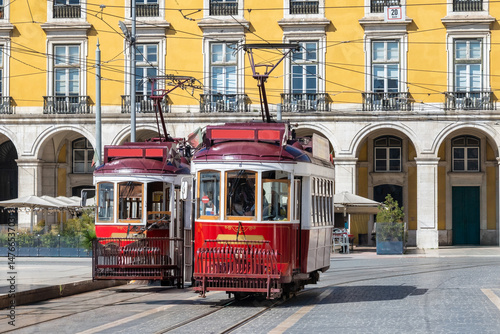 Wallpaper Mural Two Classic Red Trams in Praca do Comercio, Lisbon, Portugal Torontodigital.ca