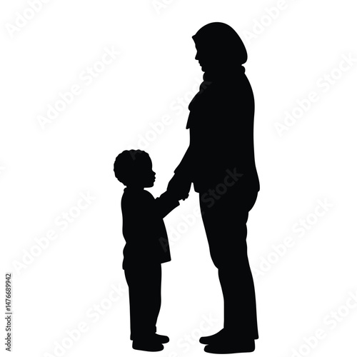 Silhouette of a mother holding her child's hand showing love and parental guidance