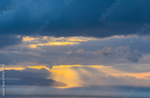 Sunset sky. Dramatic sky view. Sunlight over the sea