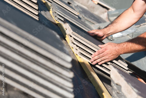 Wallpaper Mural Craftsman roofer builds new house roof from ceramic tiles Torontodigital.ca