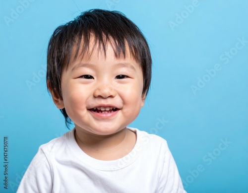 Smiling Japanese Boy in White T-Shirt with Copy Space