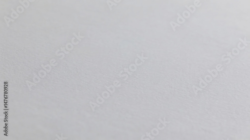 Textured close up of light gray surface showing delicate subtle variations in tone photo