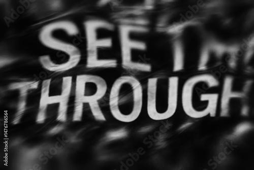 Abstract black letters on white background with distressed, grunge texture.