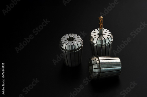 Fotografie endmill carbide in collet for cnc lathe and milling isolate on black background cutting tool concept