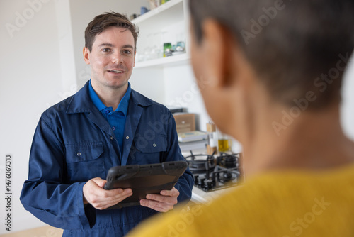 Heating engineer at a home visit 