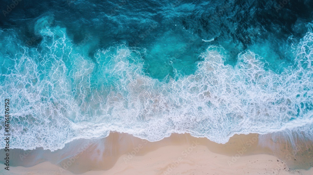 A drone shot of a coastline with summer waves crashing A drone shot of a coastline with summer waves crashing