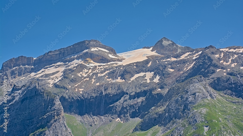 Granite alpine mountain top with glacier on a sunny day with clear blue sky in La Vanoise national park, franc Granite alpine mountain top with glacier on a sunny day with clear blue sky in La Vanoise national park, franc