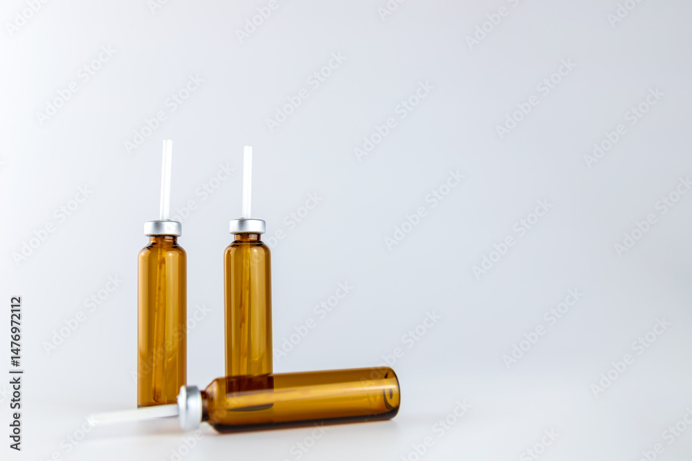 An empty bottle of oral liquid in a grey background An empty bottle of oral liquid in a grey background