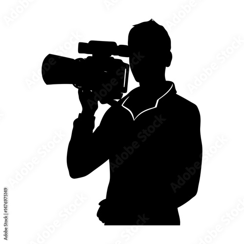 Silhouette of a man holding a professional video camera on his shoulder and looking through the viewfinder