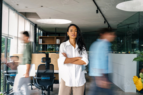 Confidence and happy smiling business woman portrait with blur motion background of his colleague