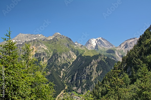 Grand Bec and surrounding mountains with pine forest ,  La VanoiseFrance photo