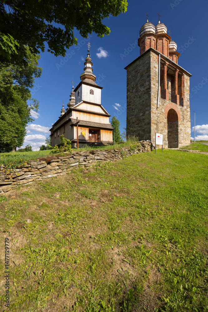 Naklejka premium Greek catholic church of the Protection of the Mother of God in Owczary, Poland, facing blue sky