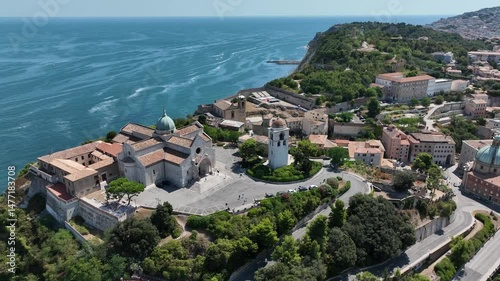 Aerial 4K footage of Ancona Cathedral on a hilltop overlooking the Adriatic Sea. Historic architecture, coastal view, and scenic landscape in central Italy.