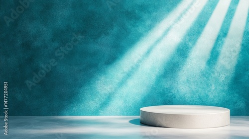 Minimalist product podium stage with blue textured wall background, featuring light rays and empty copy space for presentation.