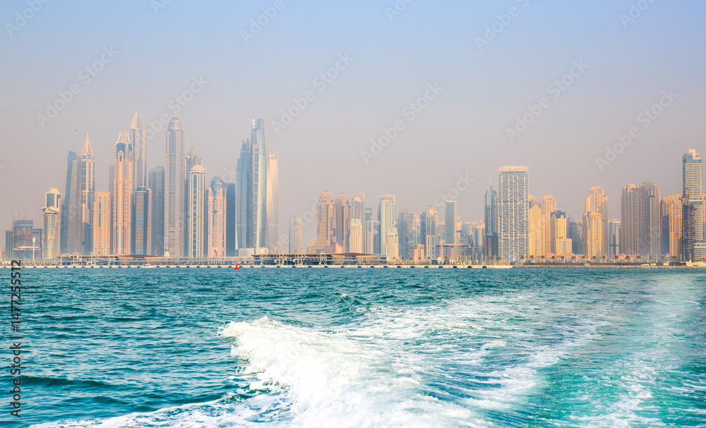 Obraz premium Dubai Marina skyscrapers and Dubai beach view from boat