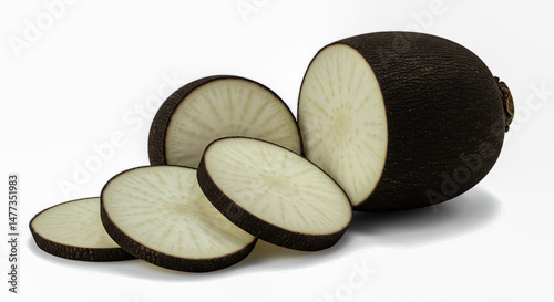 Freshly sliced black radish root showing inner white flesh against a bright white background