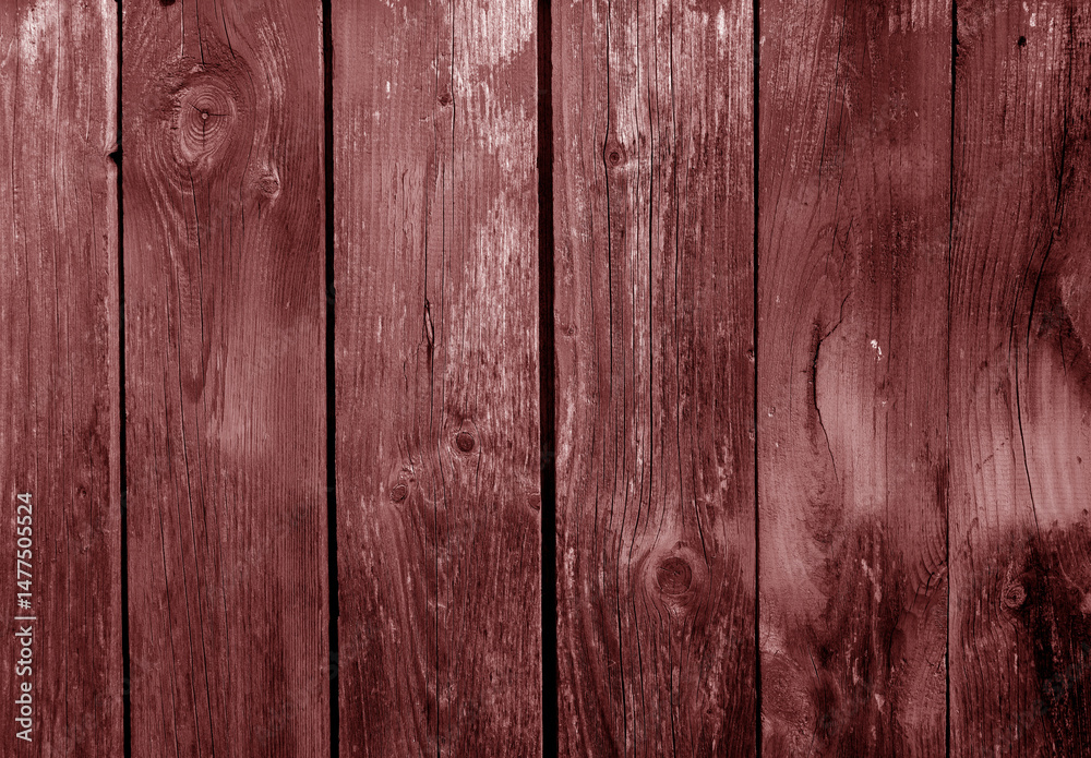 Fototapeta premium Grungy weathered red toned wooden board wall.