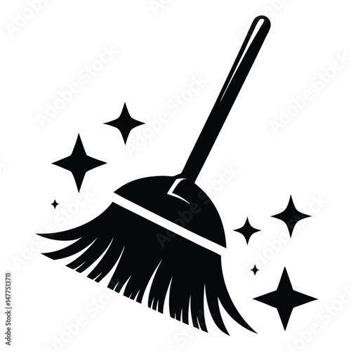 A sleek black broom with twinkling stars signifies cleanliness and a sparkling clean surface