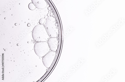 Cosmetic moisturizing gel or skin serum in a petri dish. Copy space