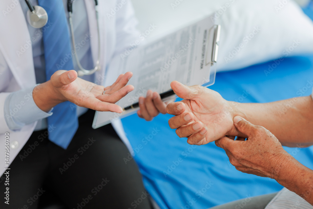 Elderly man seeks medical advice for wrist pain after strenuous work, consulting a specialist to discuss symptoms and possible treatment.