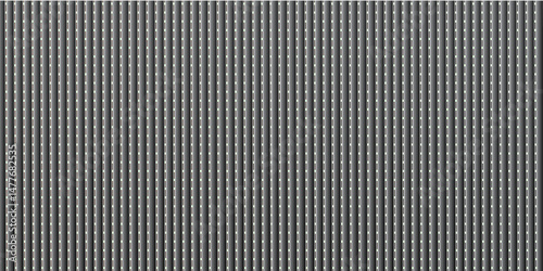 Abstract grey steel material with black and white stripes forms an abstract metallic pattern on an industrial surface