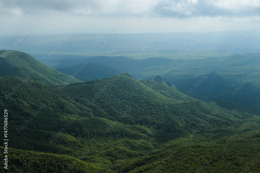 Fototapeta premium Misty Mountains and Rocky Cliff