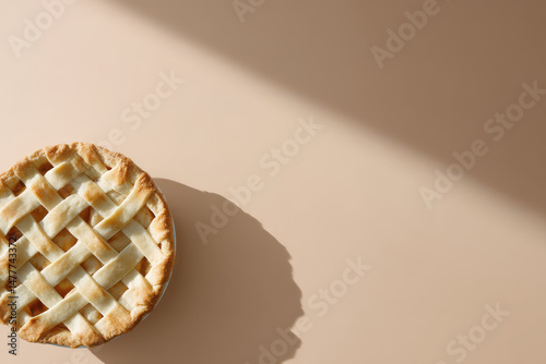 delicious pie elegantly shifted to left on solid pastel background