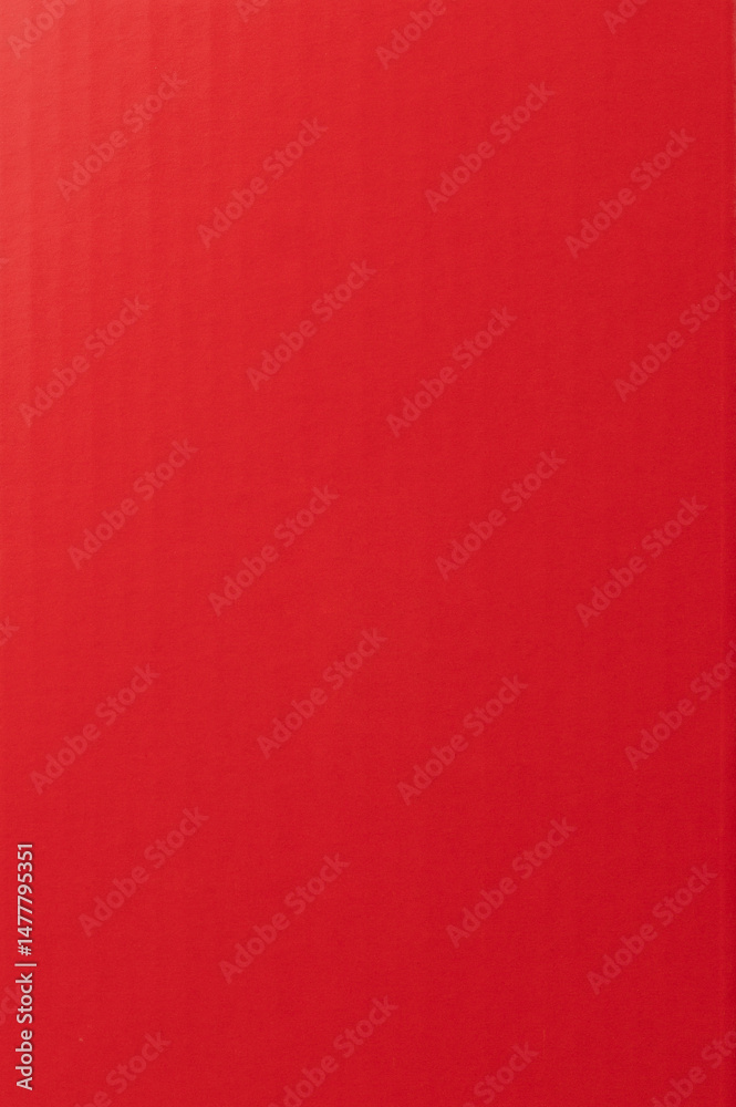 Bright red background with subtle texture for artistic projects and designs