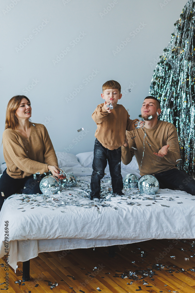 Joyful Family Celebration A Happy Child Playing Energetically Amidst Colorful Confetti and Sparkling Decorations During a Festive Gathering, Creating Wonderful Memories Filled with Joy and Laughter