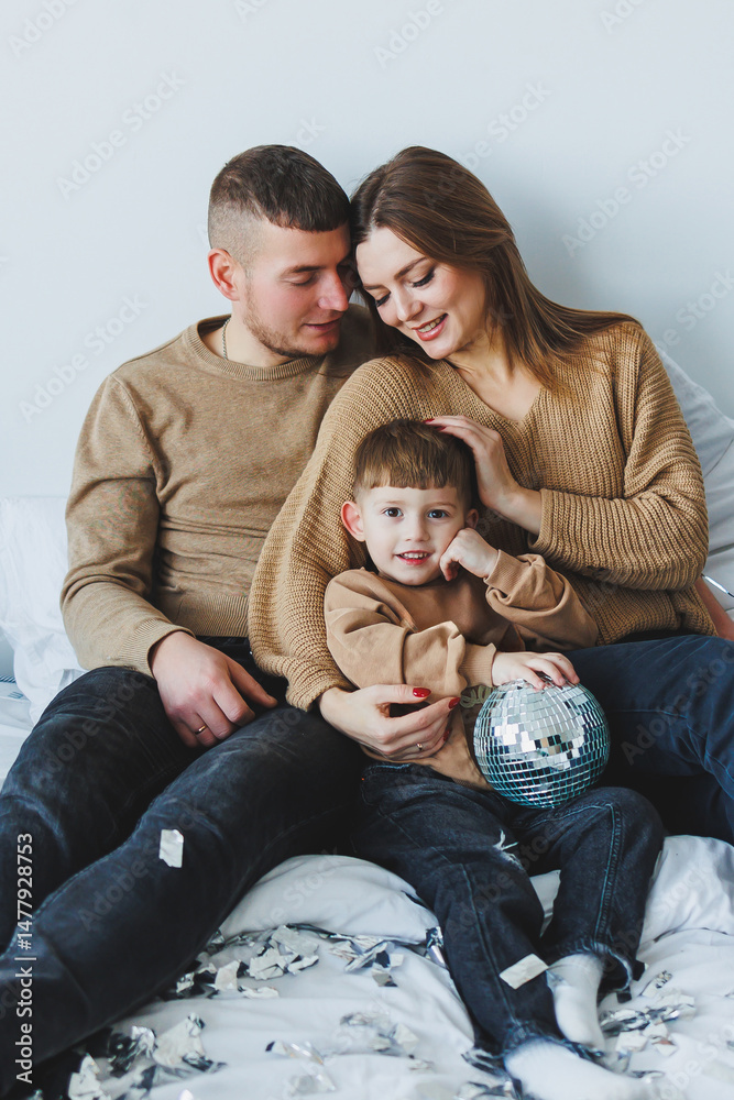 Cozy Family Portrait A Heartwarming Moment Captured Indoors Featuring a Joyful Child Engaged with Their Loving Parents, Surrounded by Comfortable Decor and Warm Expressions of Affection and Happiness