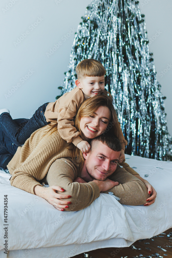 A Joyful Family Holiday Moment A Parent and Child Are Delightfully Posed Together Against a Beautiful and Festive Holiday Backdrop, Capturing the Essence of the Celebration and Togetherness