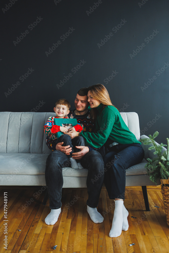 A heartwarming family moment captured in colorful winter sweaters, beautifully highlighting the joy and warmth of the festive season as it is shared with beloved family members and good friends