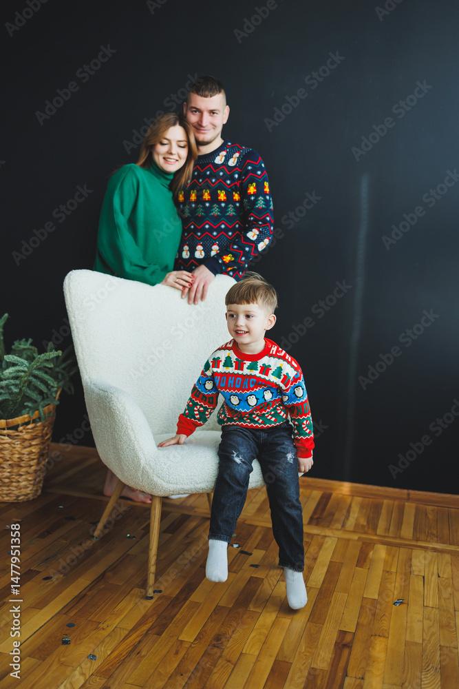 A Joyful Family Portrait Featuring Vibrant and Festive Sweaters Set Against a Modern Background, Perfectly Capturing the Essence of Happiness and Togetherness During the Holiday Season