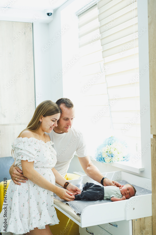 Newly Became Parents Cherishing Beautiful, Precious Moments with Their Newborn in a Bright, Cheerful Nursery Setting that is Filled with an Abundance of Natural Light and Joyful Atmosphere
