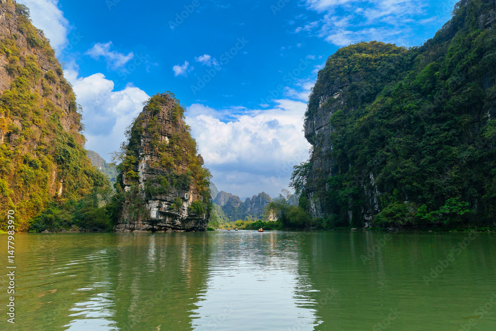 Fototapeta premium Scenic limestone karsts and tranquil waters in Ninh Binh, Vietnam