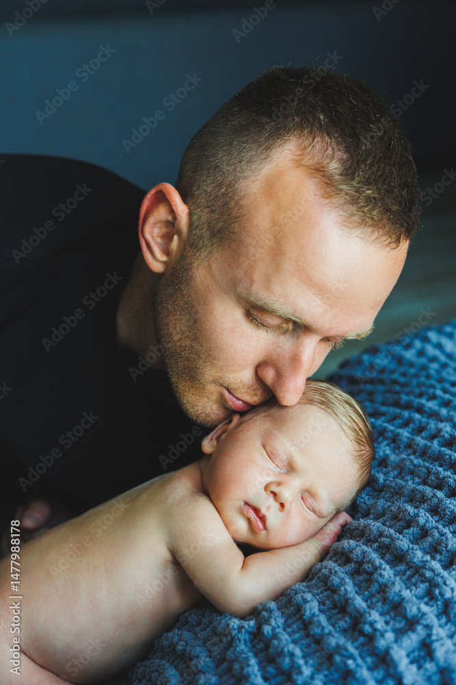In a serene and peaceful atmosphere, a father gently kisses his precious newborn, illustrating the profound emotional bond and unconditional love that beautifully define the essence of fatherhood