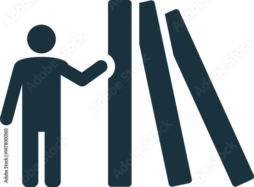 Businessman pushing first domino starting chain reaction effect