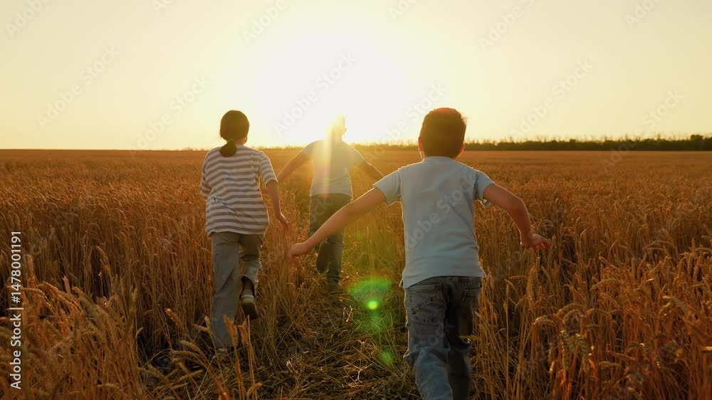 Teenagers play outdoors. Children running together in wheat field sunset. Children happiness concept. Happy family, joyful boy girl run in countryside. Happy kids fun, child play run in summer field