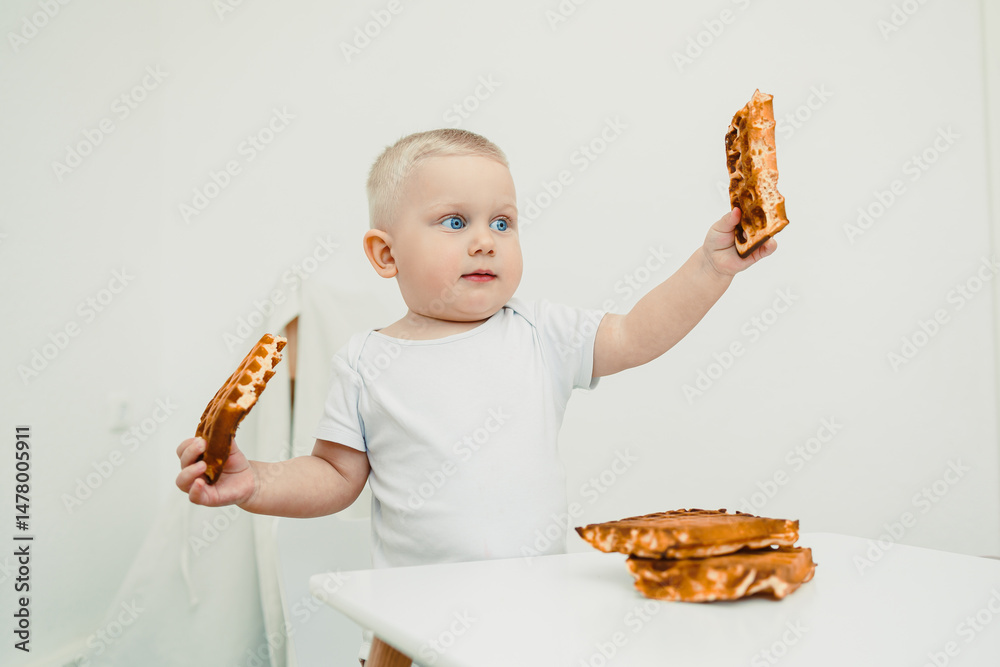 A Curious Baby is Gently Exploring Delicious Waffles in a Bright, Minimalist Kitchen Setting Filled with Light and Cheerful Colors, Creating a Perfect Environment for Fun and Playful Moments