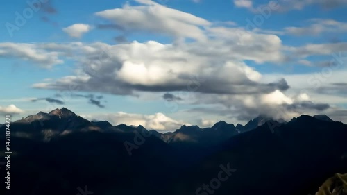 Majestic mountain range against a cloudy sky, showcasing nature's beauty, ideal for travel documentaries, environmental projects and adventure tourism promotions.