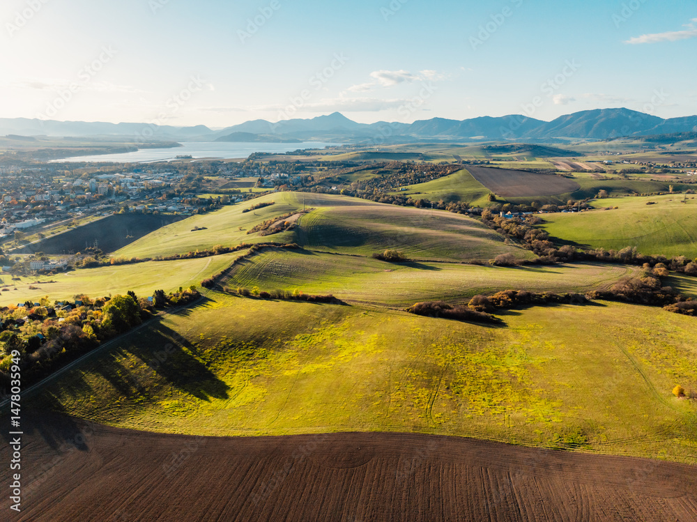 Sunset over Liptov region with High Tatras mountains around. Liptovsky Mikulas landscape, Slovakia.