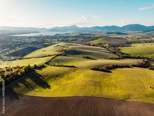 Sunset over Liptov region with High Tatras mountains around. Liptovsky Mikulas landscape, Slovakia.