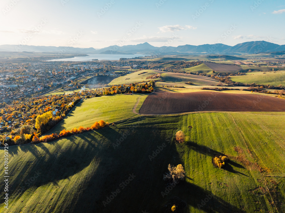 Sunset over Liptov region with High Tatras mountains around. Liptovsky Mikulas landscape, Slovakia.